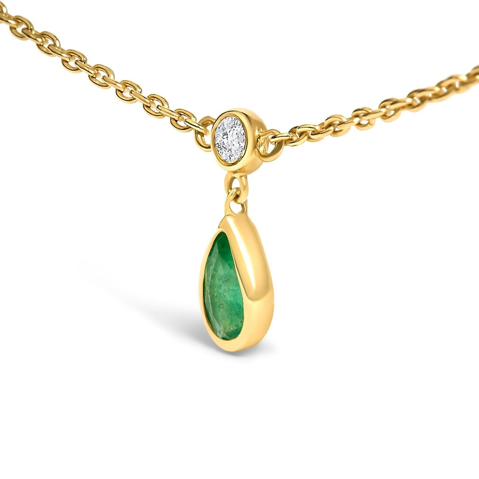 10K Yellow Gold Dangling 5x3 mm Green Emerald and Diamond Station Necklace - 18
