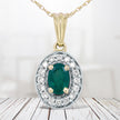 14K Yellow Gold 6x4mm Emerald and 1/5 Cttw Round Diamond Halo Pendant 18