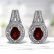 .925 Sterling Silver Diamond Accent and 8x6mm Red Oval Garnet Stud Earrings (I-J Color, I1-I2 Clarity)